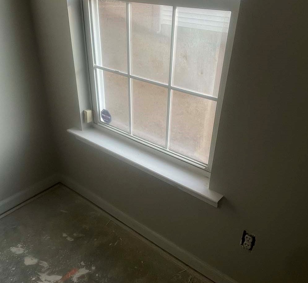 Repaired interior window sill and stool with clean trim enamel finish in Fayetteville NC